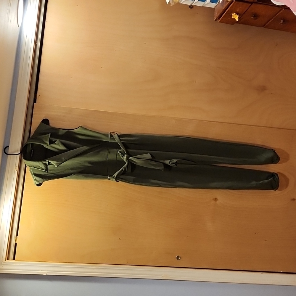 Pretty little thing one piece jump suit green, size 12.